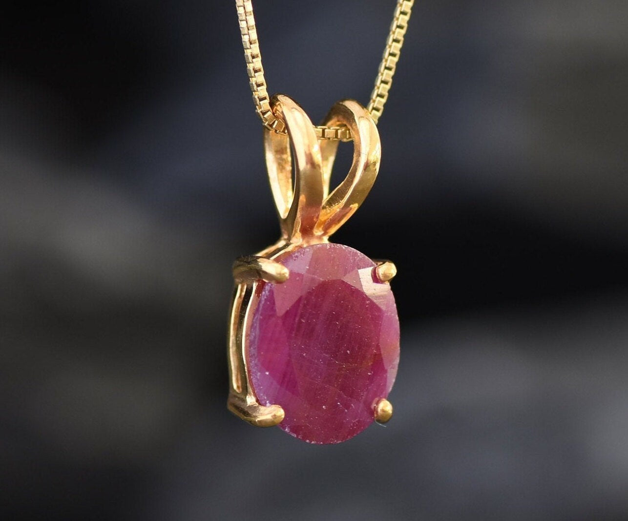 Elegant 18k Gold Vermeil Natural Ruby Pendant featuring an oval ruby, perfect for birthdays and special occasions.