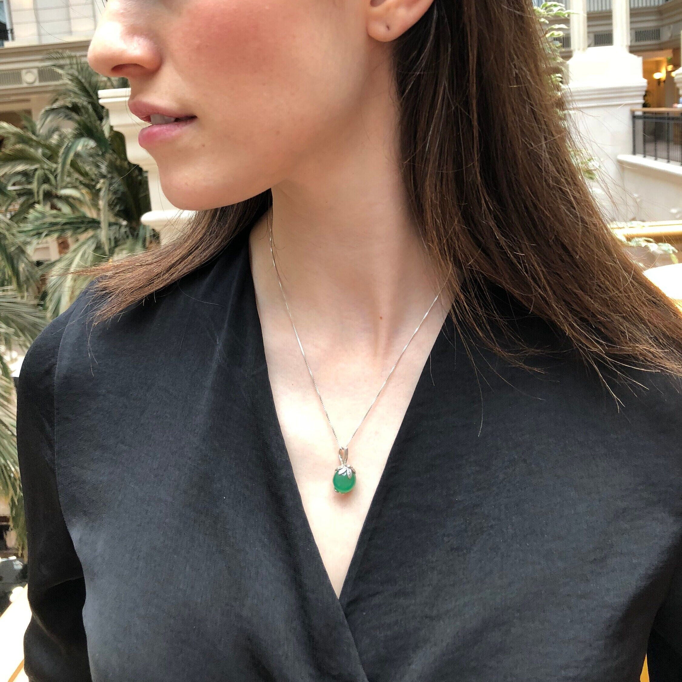 Stylish 925 Sterling Silver earrings featuring round Created Green Emeralds, perfect for May birthdays and special occasions.