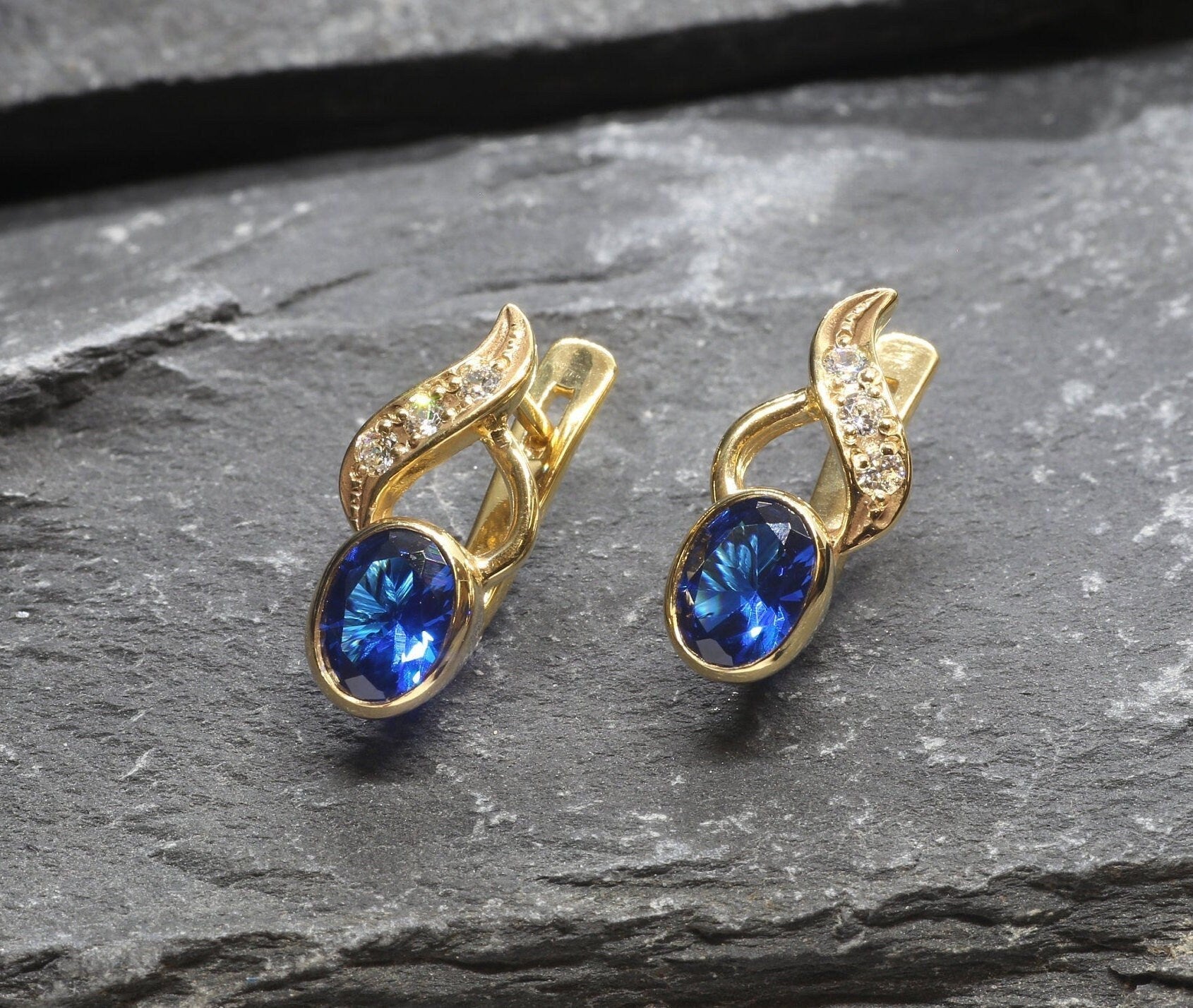 Created Sapphire Earrings made in 18k Gold Vermeil with Oval Created Blue Sapphire in Bezel setting, September Birthstone gift idea, symbolizes sincerity, truth, and faithfulness, ideal for everyday wear and perfect for birthday gifting and special occasions.