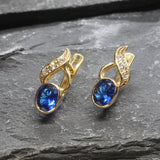 Created Sapphire Earrings made in 18k Gold Vermeil with Oval Created Blue Sapphire in Bezel setting, September Birthstone gift idea, symbolizes sincerity, truth, and faithfulness, ideal for everyday wear and perfect for birthday gifting and special occasions.