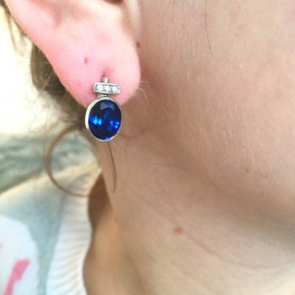 Beautiful 925 Sterling Silver Sapphire Earrings with Oval Created Blue Sapphire, perfect for September birthdays and special occasions.