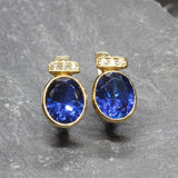 Created Sapphire Earrings made in 18k Gold Vermeil with Oval Created Blue Sapphire in Bezel setting, September Birthstone gift idea, symbolizes sincerity, truth, and faithfulness, ideal for everyday wear and perfect for birthday gifting and special occasions.