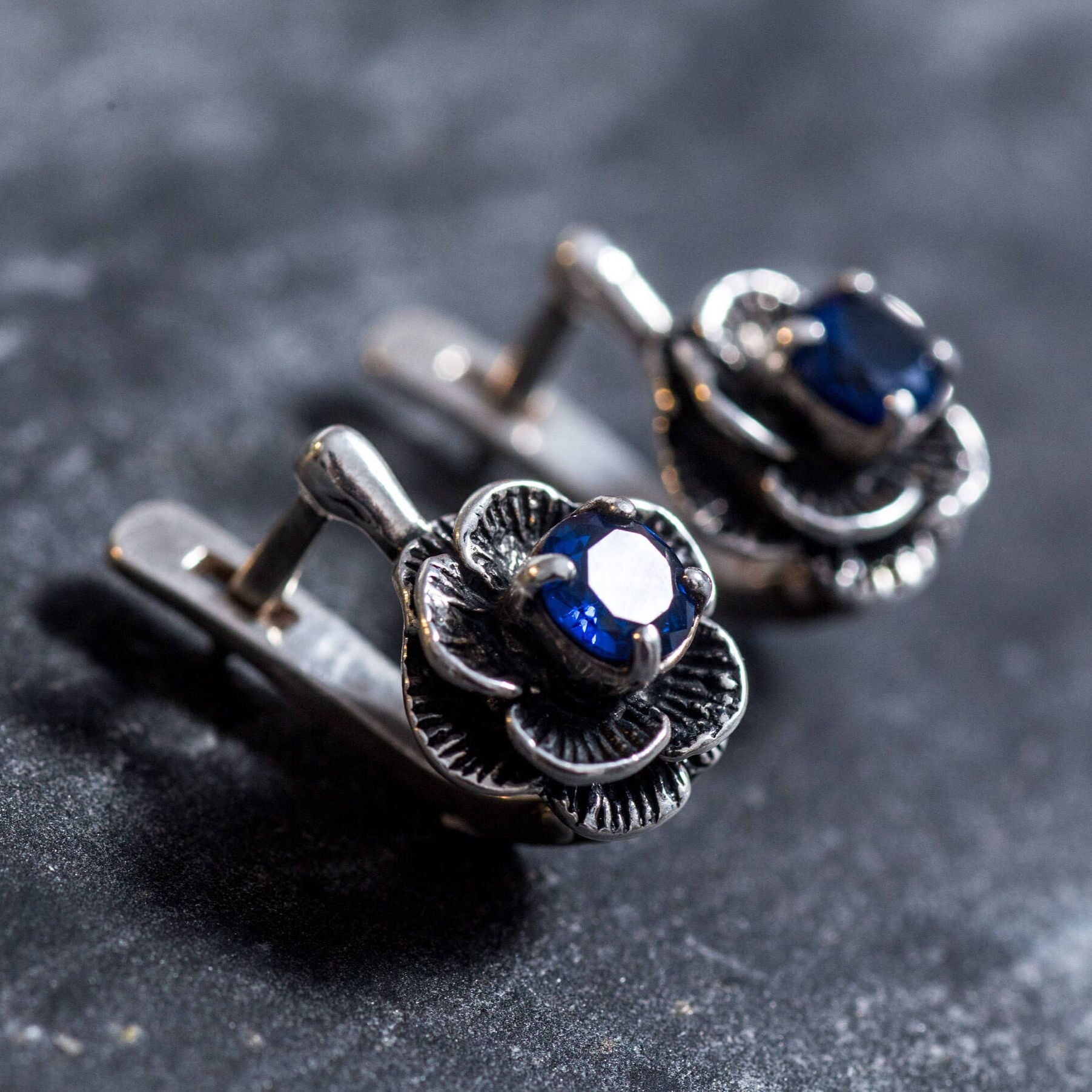 Handcrafted Sapphire Earrings in sterling silver with prong-set blue sapphires, perfect for celebrating September birthdays with elegance.