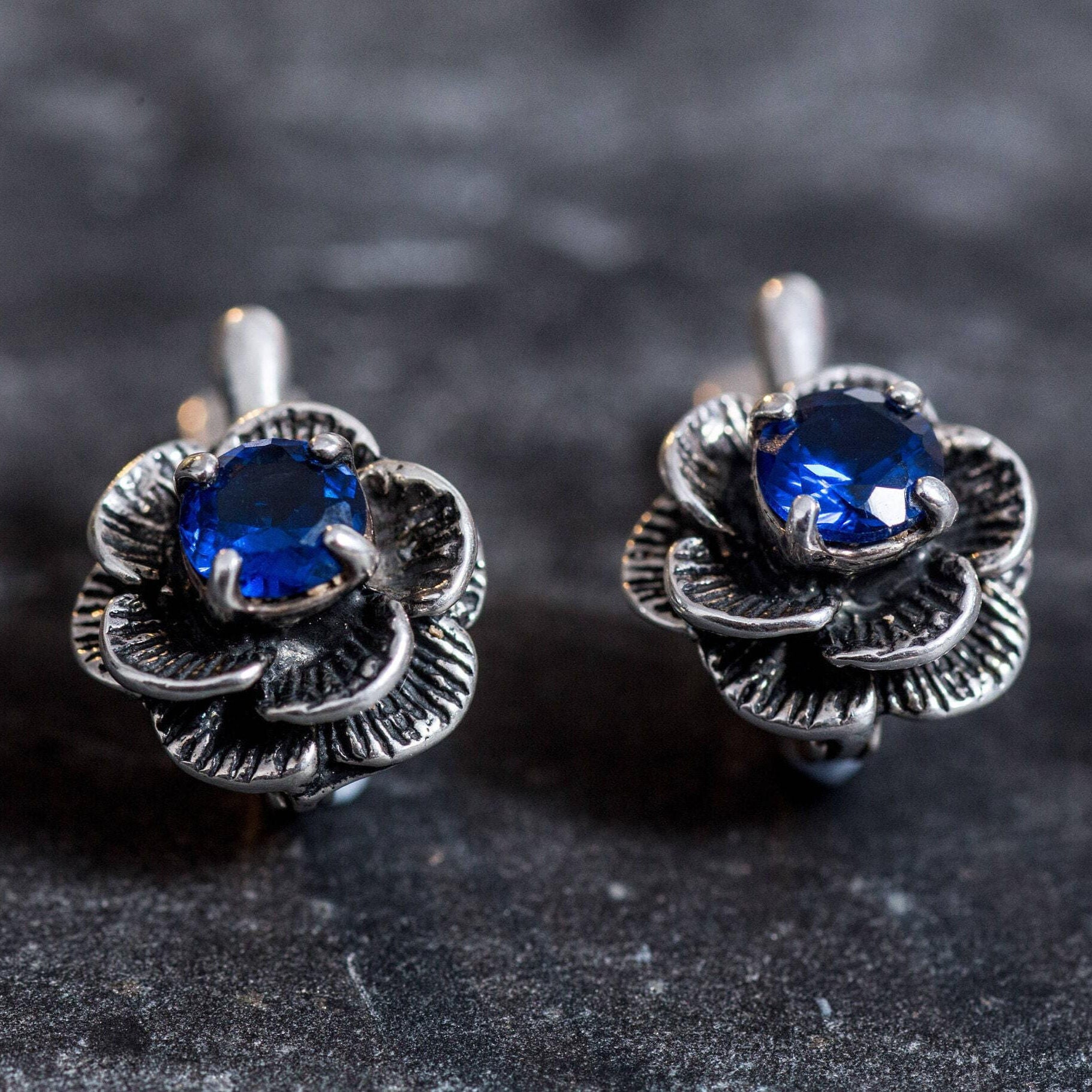 Stunning Created Blue Sapphire Earrings in 925 Sterling Silver, embodying elegance and charm, a lovely gift for any occasion.