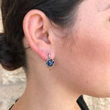 Lovely Created Sapphire Earrings in sterling silver with round blue sapphires, symbolizing love and loyalty, perfect for gifting.