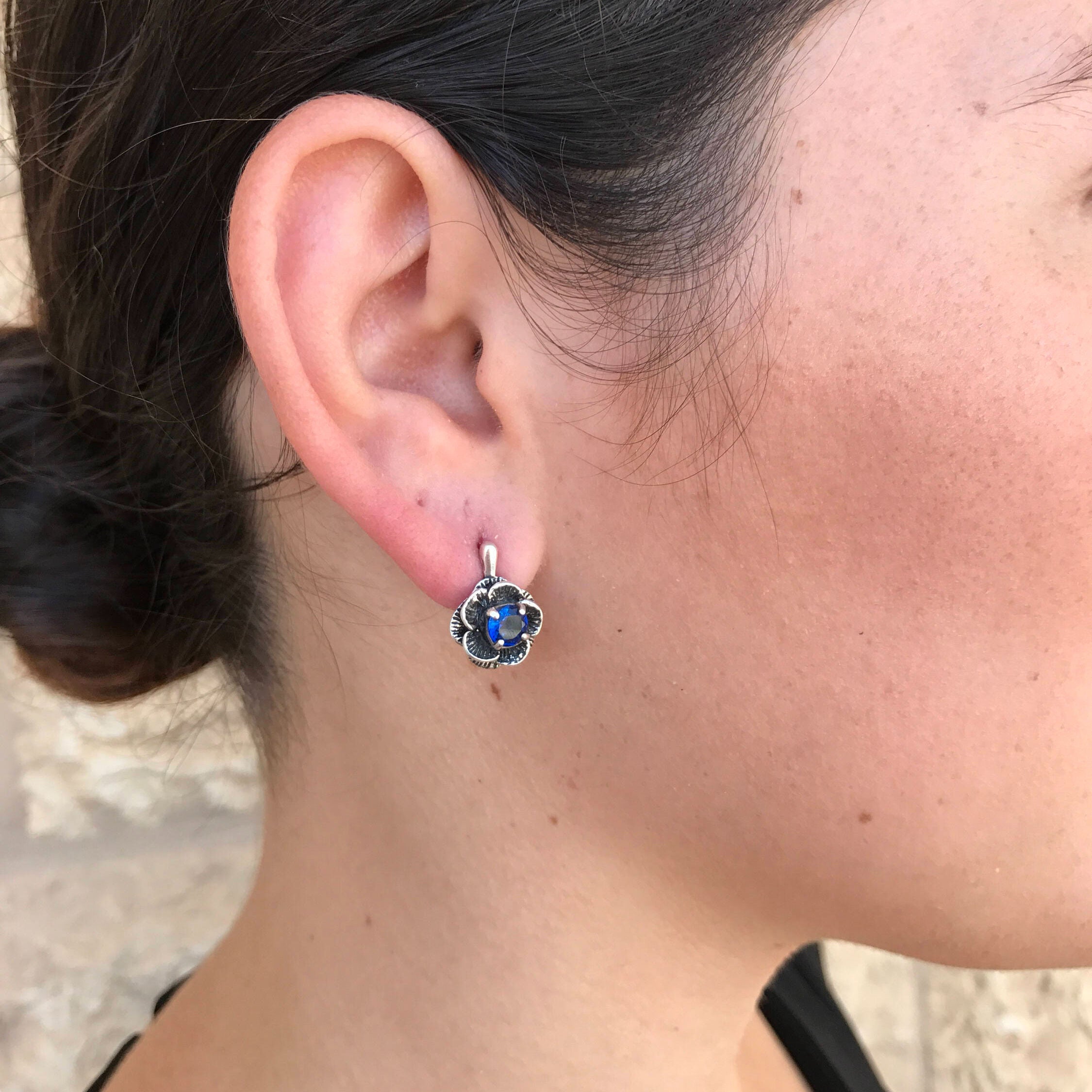 Lovely Created Sapphire Earrings in sterling silver with round blue sapphires, symbolizing love and loyalty, perfect for gifting.