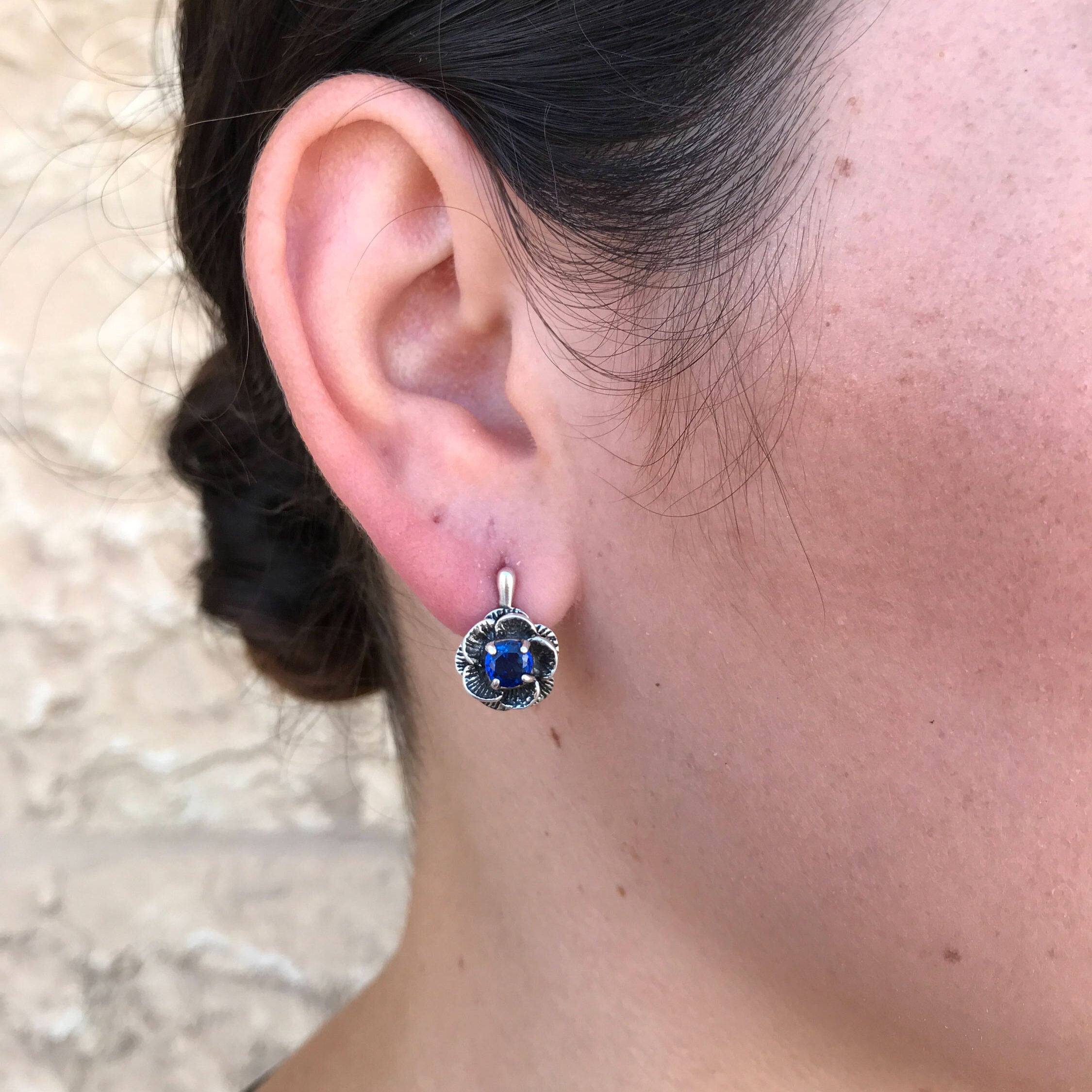 Created Sapphire Earrings in 925 Sterling Silver, showcasing round blue gems, a beautiful choice for special occasions and daily elegance.