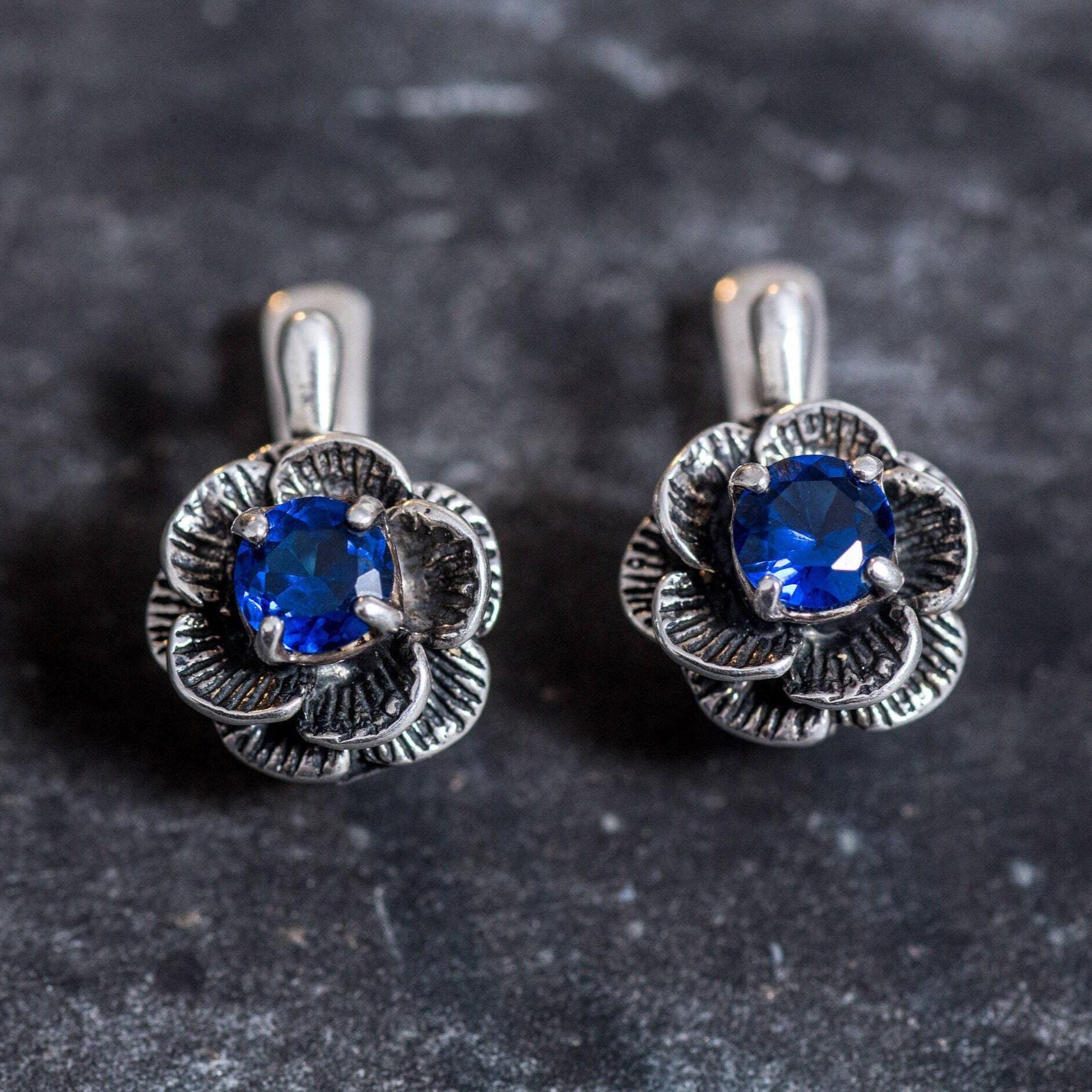 Elegant Created Sapphire Earrings in 925 Sterling Silver, featuring vibrant blue stones, a timeless gift for September birthdays.
