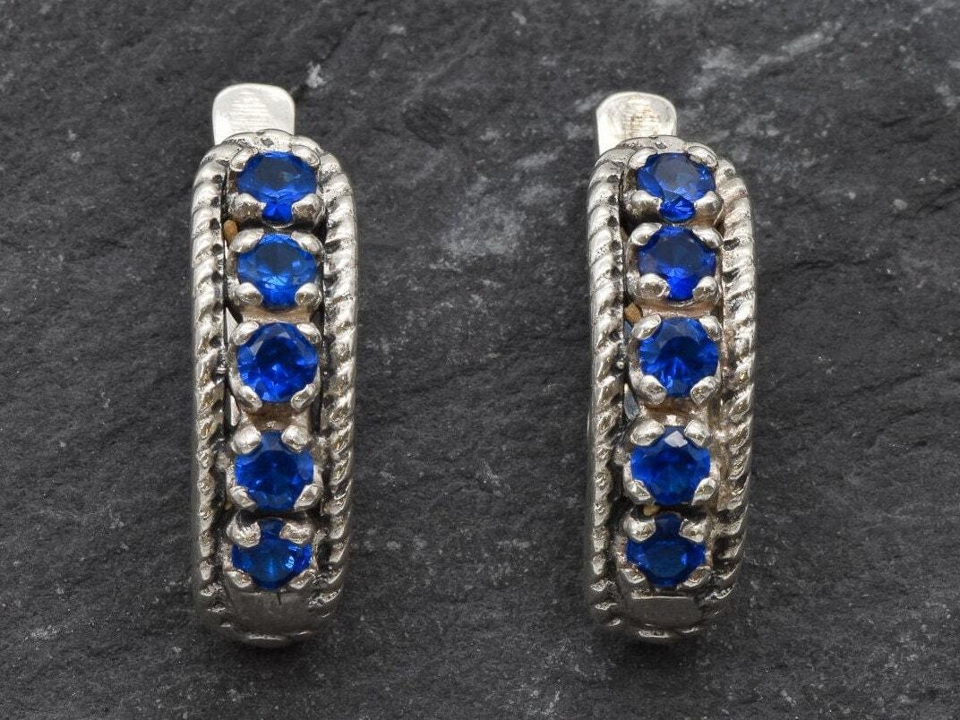 Created Sapphire Earrings made in 925 Sterling Silver with Round Created Blue Sapphire in Channel-Set setting, September Birthstone gift idea, symbolizes sincerity, truth, and faithfulness, ideal for everyday wear and perfect for birthday gifting and special occasions.