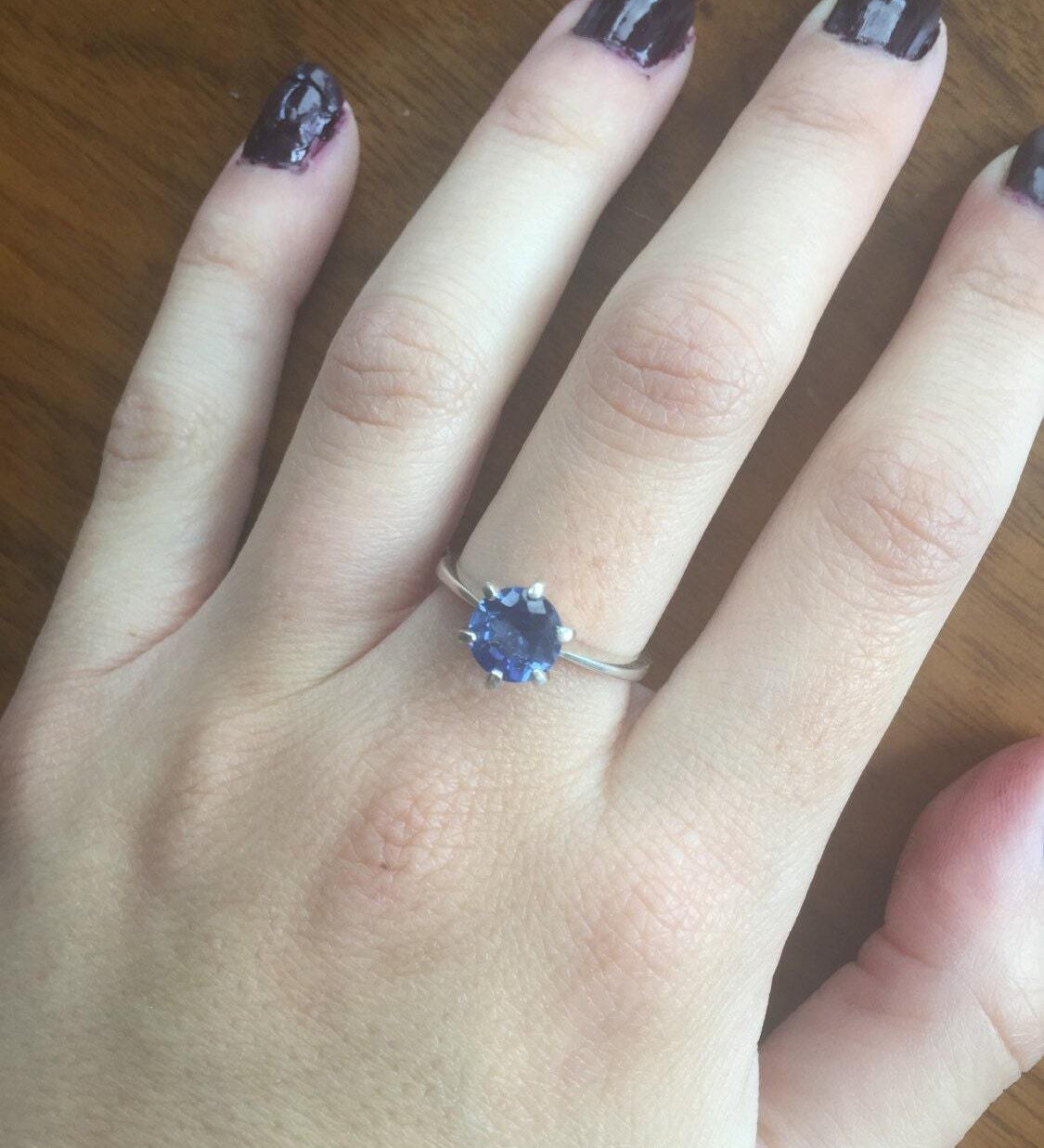 Beautiful 925 Sterling Silver ring featuring a round Created Blue Sapphire, perfect September birthstone gift for any occasion.