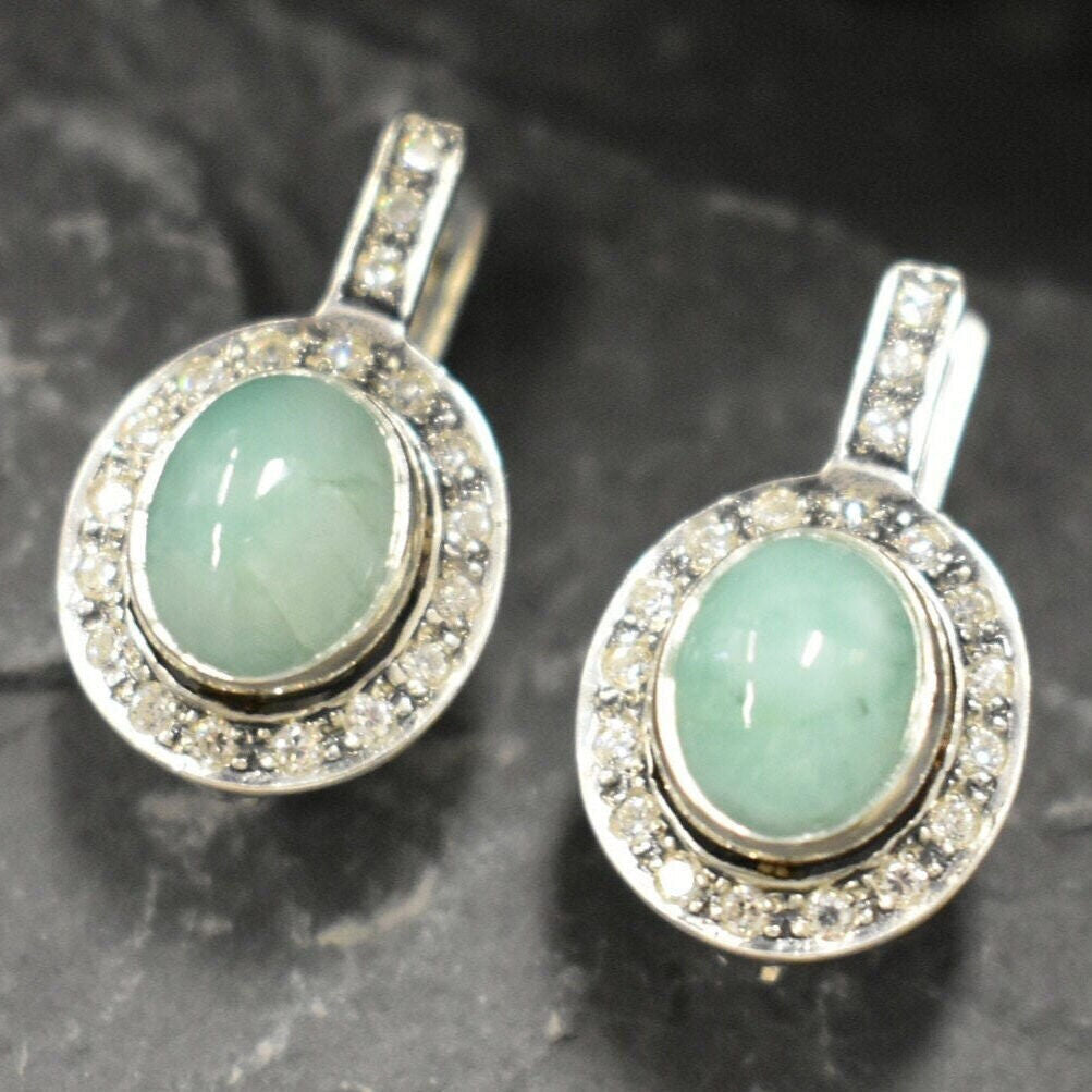 Natural Emerald Earrings made in 925 Sterling Silver with Oval Natural Green Emerald in Bezel setting, May Birthstone gift idea, symbolizes growth, harmony, and deep emotional healing, ideal for everyday wear and perfect for birthday gifting and special occasions.