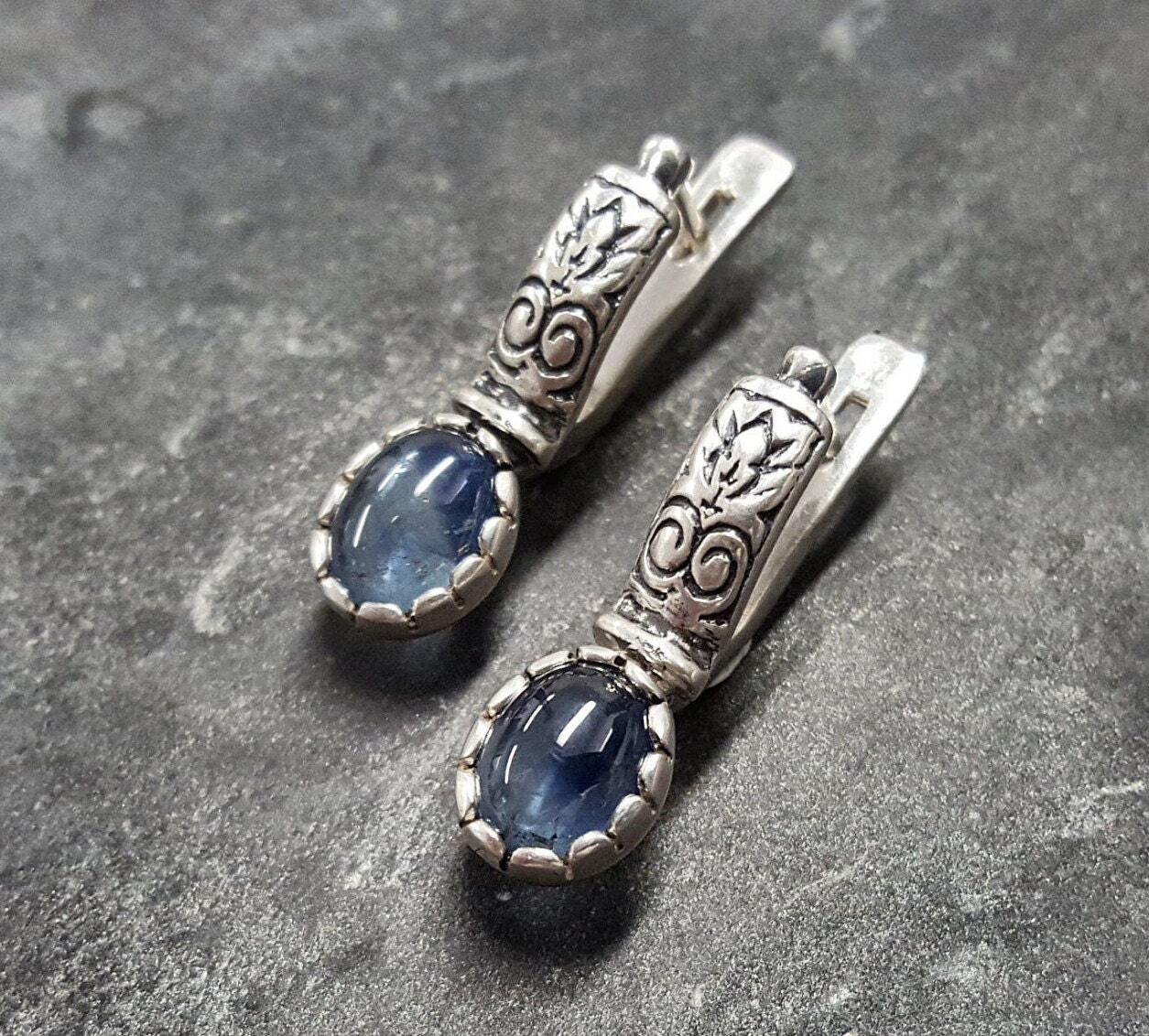 Natural Sapphire Earrings made in 925 Sterling Silver with Oval Natural Blue Sapphire in Prong setting, September Birthstone gift idea, symbolizes sincerity, truth, and faithfulness, ideal for everyday wear and perfect for birthday gifting and special occasions.