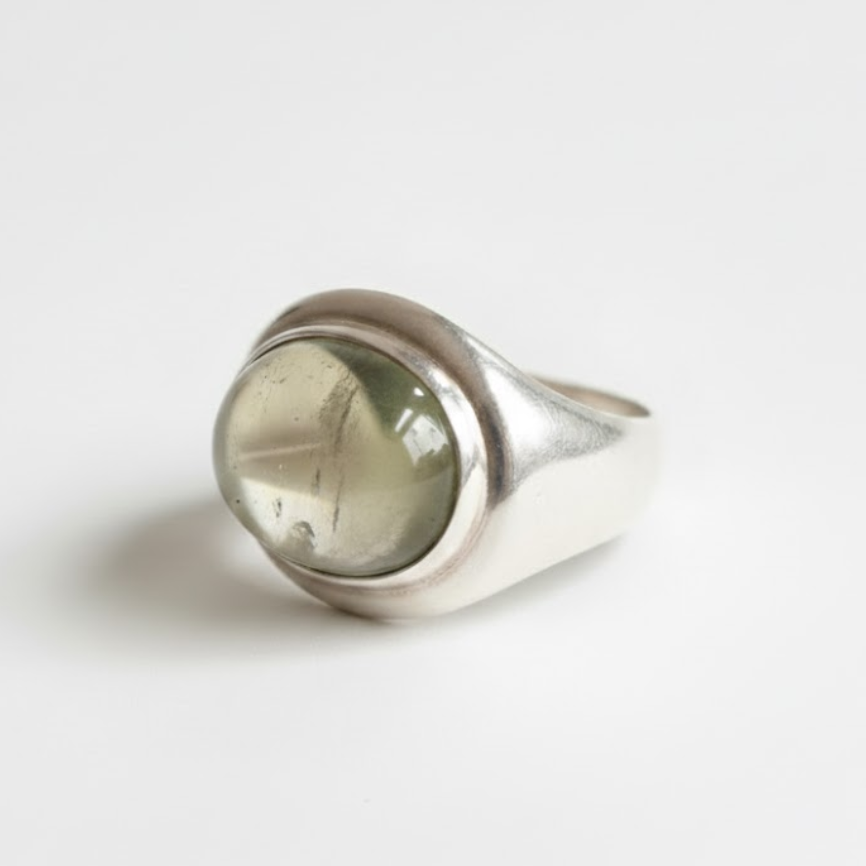 A beautifully arranged collection of colorful gemstones displayed on a sleek table, highlighting their vibrant hues and cuts.