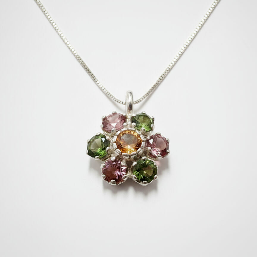 A multicolor tourmaline flower pendant set in Solid 925 Sterling Silver, ideal for unique gifting