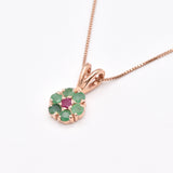 Charming rose gold vermeil pendant adorned with a vibrant natural emerald cluster, representing growth and harmony.