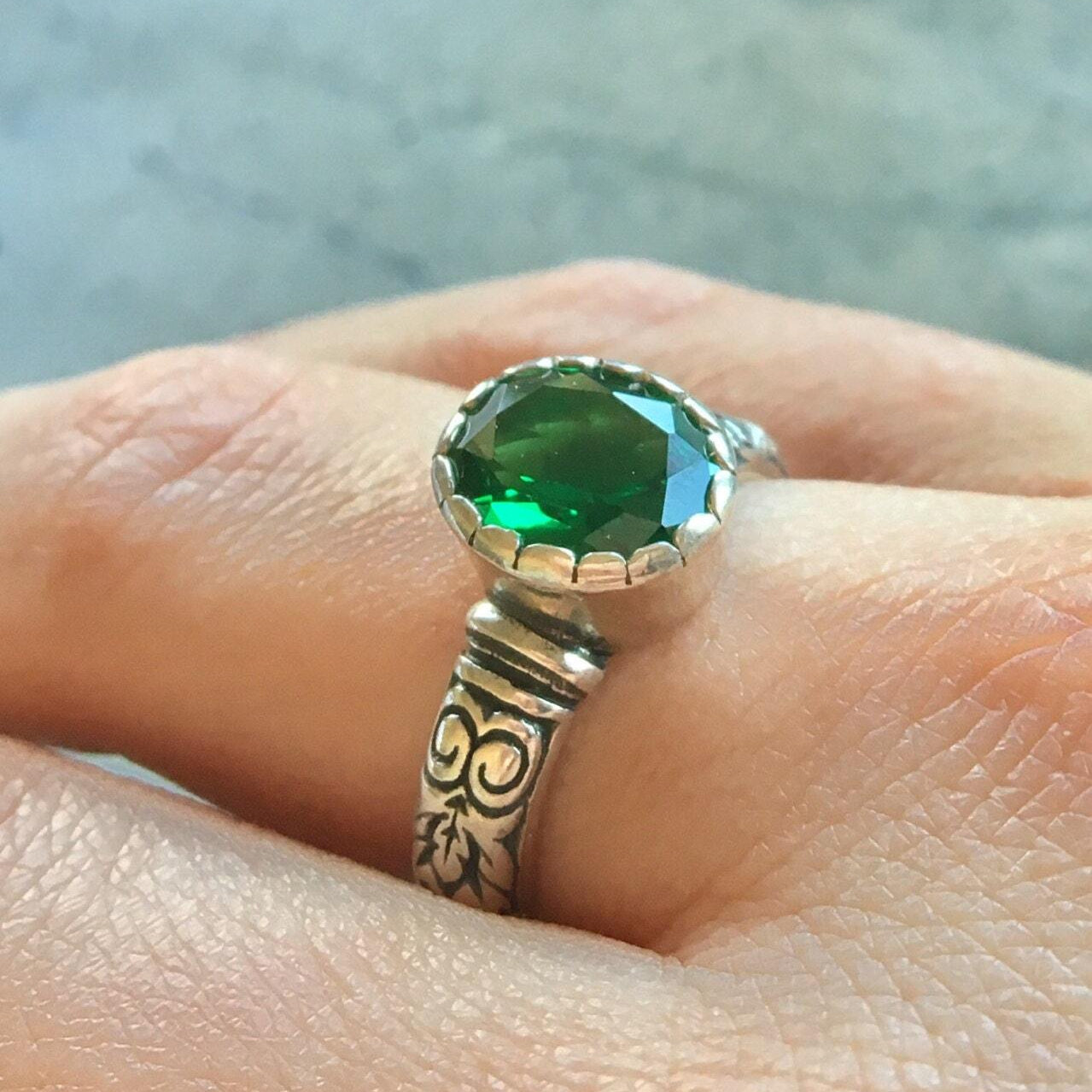 Elegant Sterling Silver Emerald Ring featuring a stunning oval green emerald, perfect for everyday wear or special occasions.