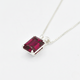 Crafted in 925 Sterling Silver, this Ruby Pendant with a baguette Created Red Ruby is a meaningful July birthday gift.