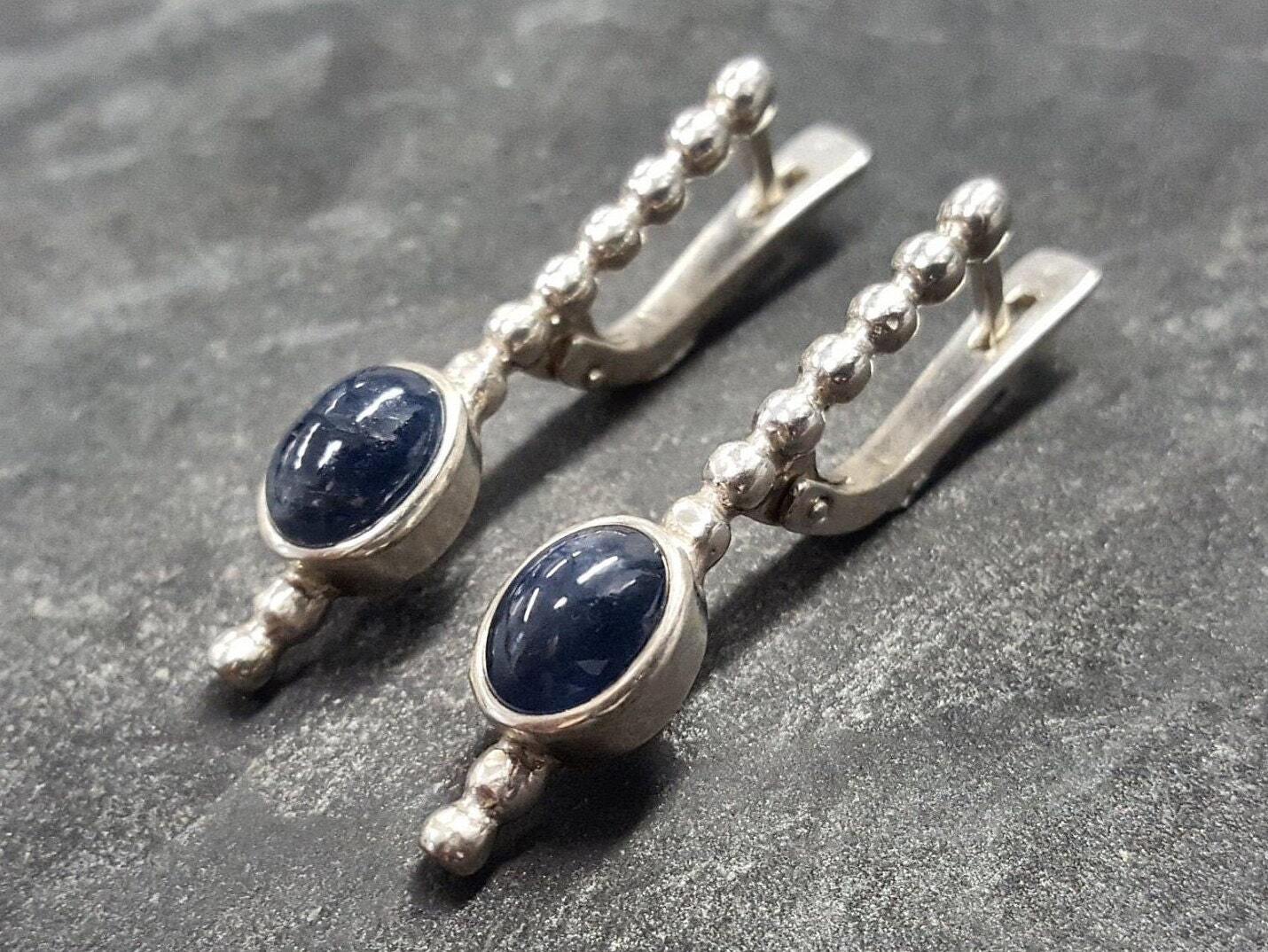 Natural Sapphire Earrings made in 925 Sterling Silver with Oval Natural Blue Sapphire in Bezel setting, September Birthstone gift idea, symbolizes sincerity, truth, and faithfulness, ideal for everyday wear and perfect for birthday gifting and special occasions.