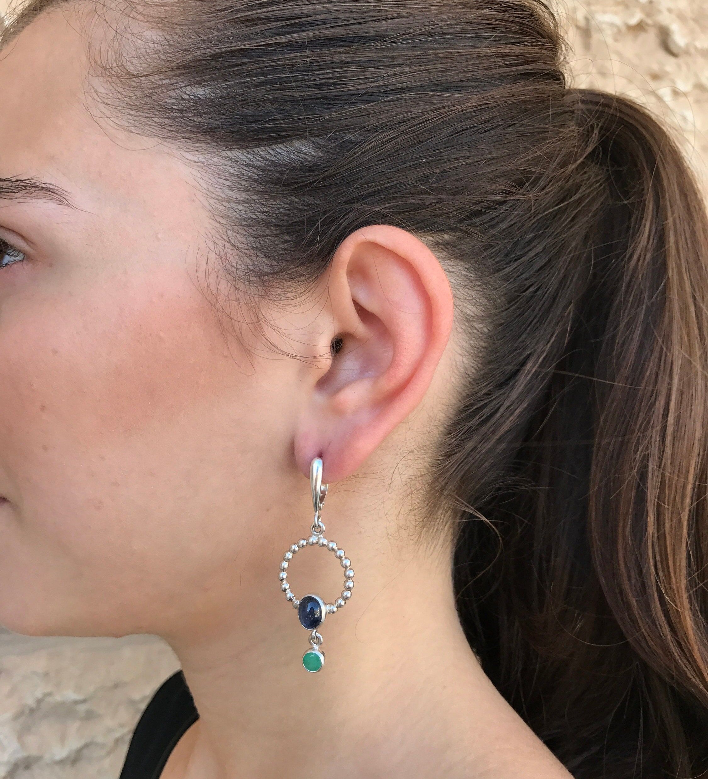 Elegant 925 Sterling Silver earrings featuring Oval Blue Sapphire, a timeless September birthstone gift for special occasions.