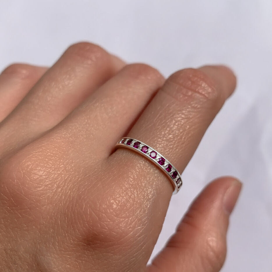 Elegant 925 Sterling Silver ruby ring with round Created Red Ruby in channel-set, July birthstone for special occasions.
