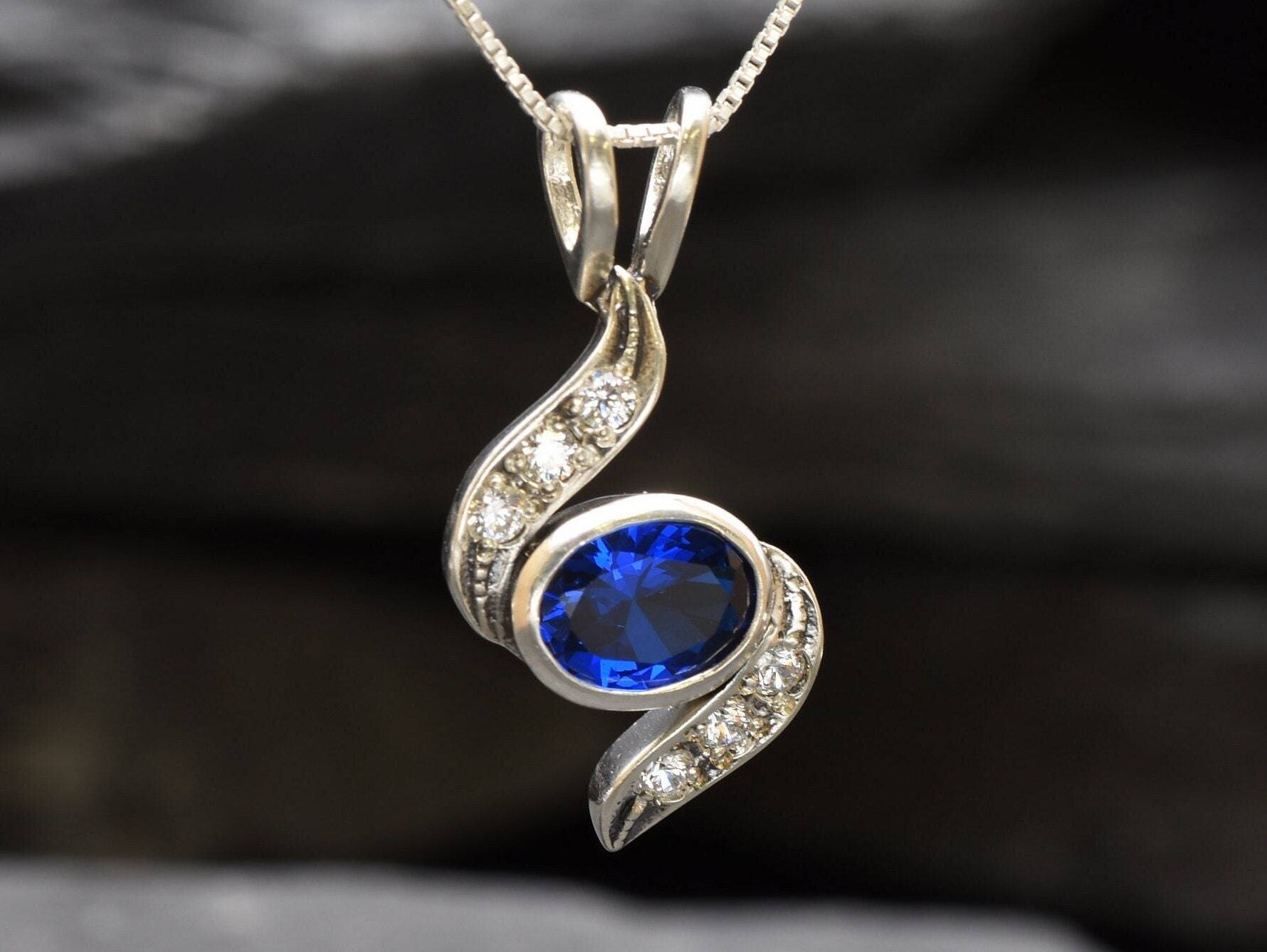 Created Sapphire Pendant made in 925 Sterling Silver with Baguette Created Blue Sapphire in Bezel setting, September Birthstone gift idea, symbolizes sincerity, truth, and faithfulness, ideal for everyday wear and perfect for birthday gifting and special occasions.