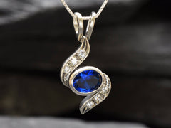 Created Sapphire Pendant made in 925 Sterling Silver with Baguette Created Blue Sapphire in Bezel setting, September Birthstone gift idea, symbolizes sincerity, truth, and faithfulness, ideal for everyday wear and perfect for birthday gifting and special occasions.