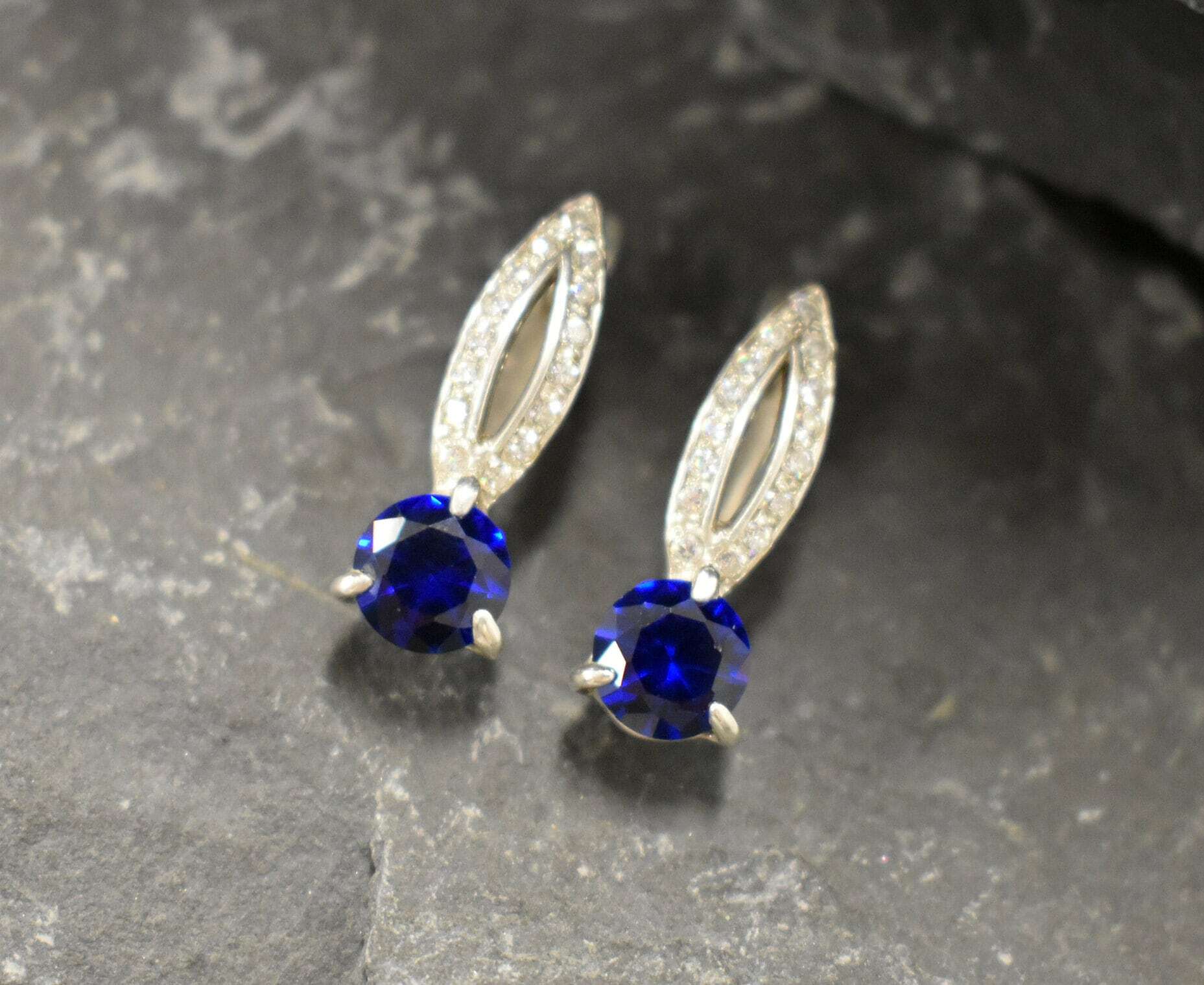 Created Sapphire Earrings made in 925 Sterling Silver with Round Created Blue Sapphire in Solitaire with Accents setting, September Birthstone gift idea, symbolizes sincerity, truth, and faithfulness, ideal for everyday wear and perfect for birthday gifting and special occasions.