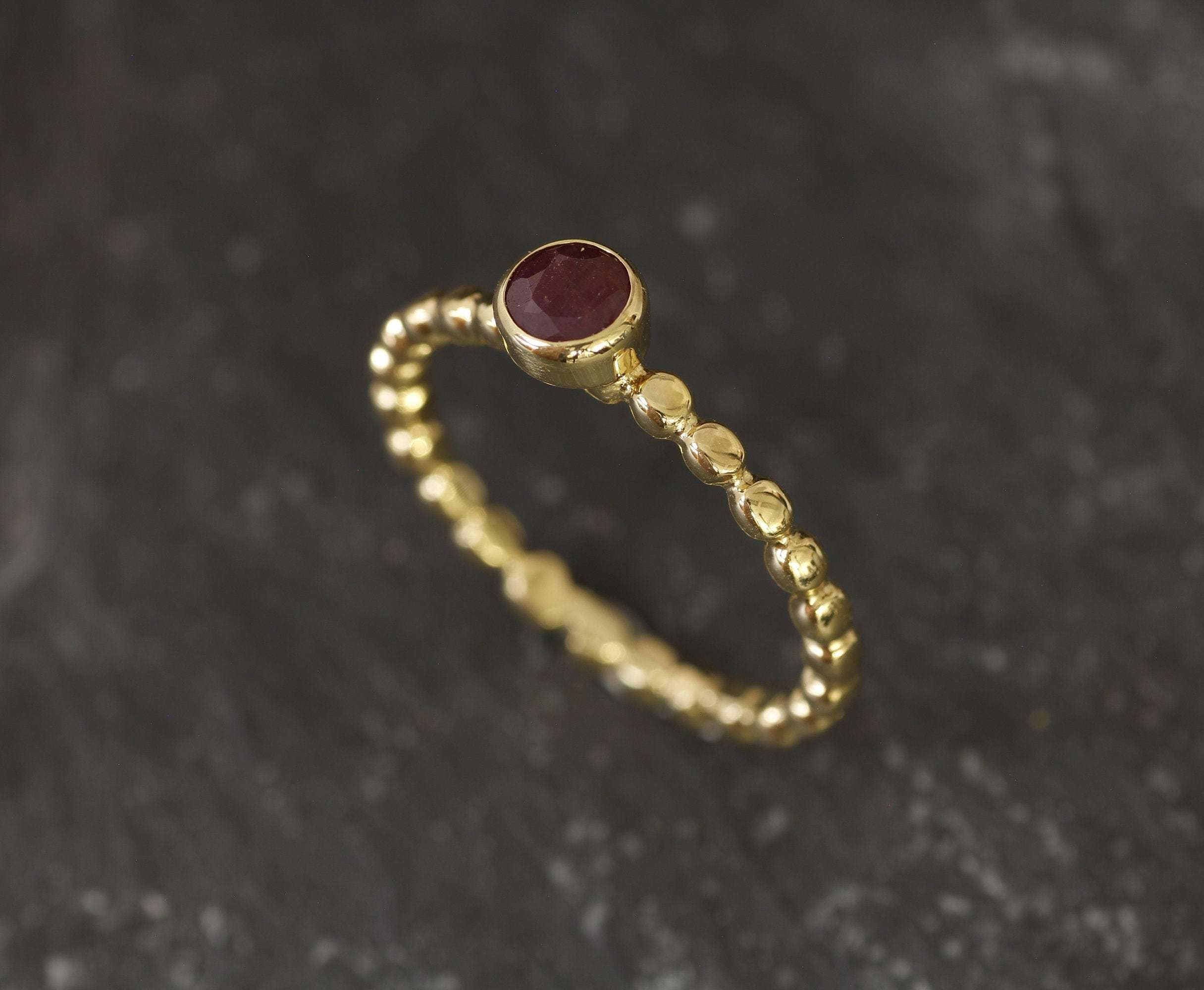 Elegant 18k Gold Vermeil ring featuring a round natural ruby, perfect for everyday wear and special occasions.