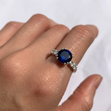 Elegant 925 Sterling Silver ring featuring a round Created Blue Sapphire, perfect for birthdays or special occasions.