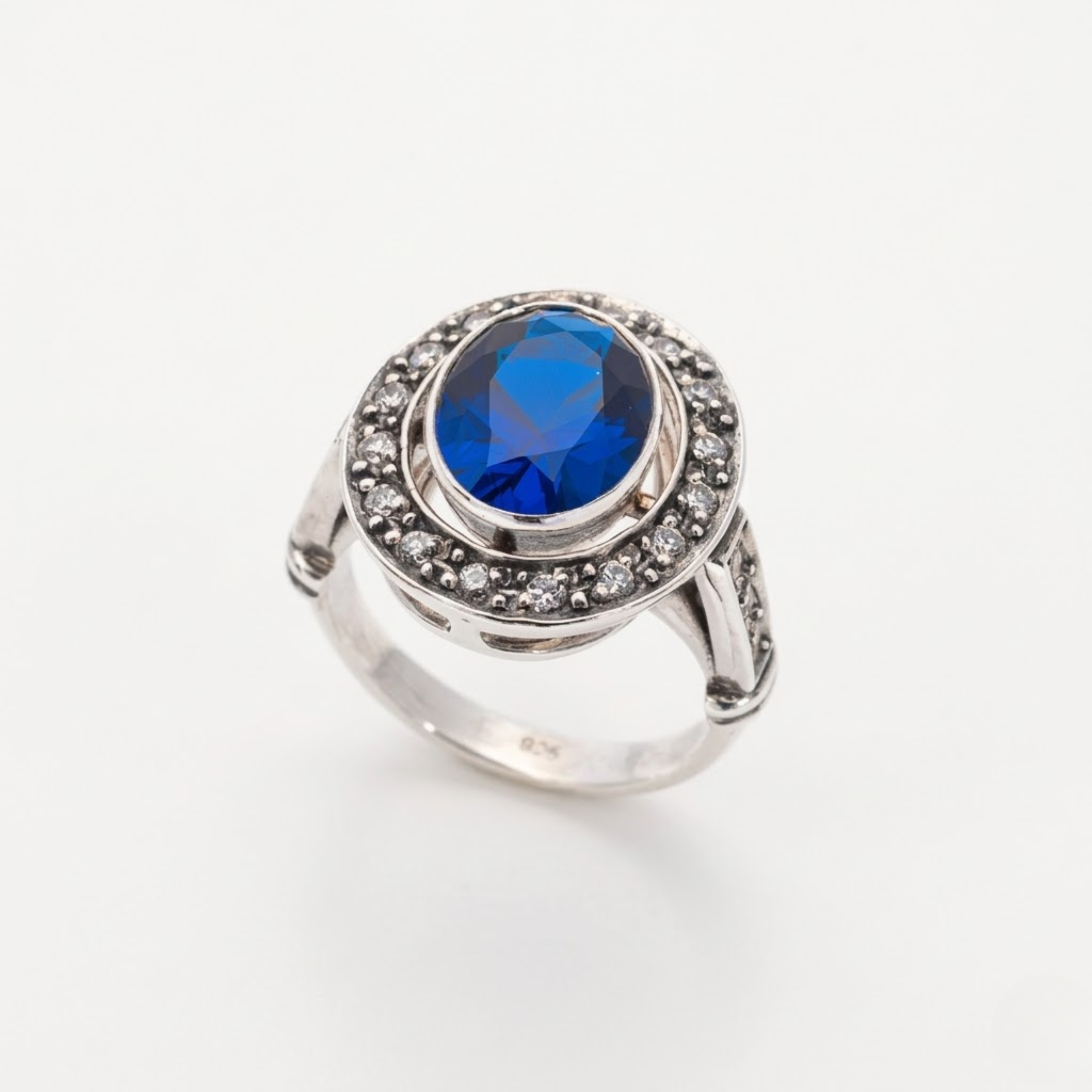 Created Sapphire Ring made in 925 Sterling Silver with Oval Created Blue Sapphire in Bezel setting, September Birthstone gift idea, symbolizes sincerity, truth, and faithfulness, ideal for everyday wear and perfect for birthday gifting and special occasions.