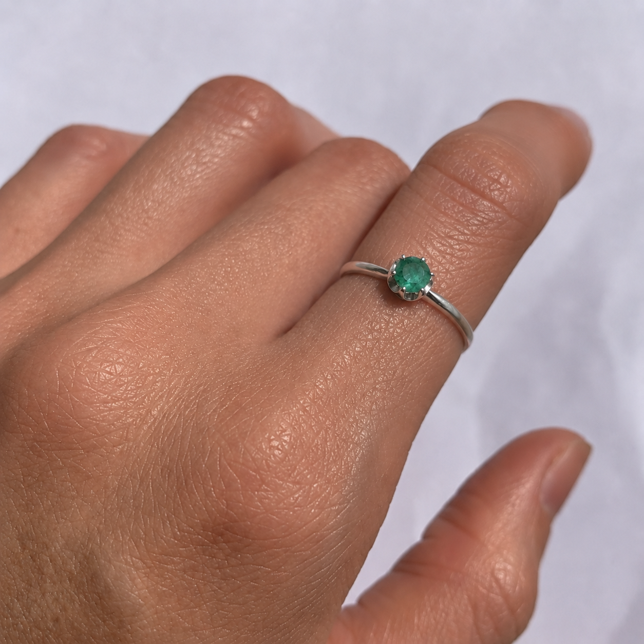 Elegant 925 Sterling Silver ring featuring a Round Natural Green Emerald, May Birthstone, perfect for special occasions.