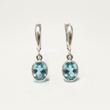 Created Aquamarine Earrings made in 925 Sterling Silver with Oval Created Blue Aquamarine in Bezel setting, March Birthstone gift idea, symbolizes courage & good luck, ideal for everyday wear and perfect for birthday gifting and special occasions.