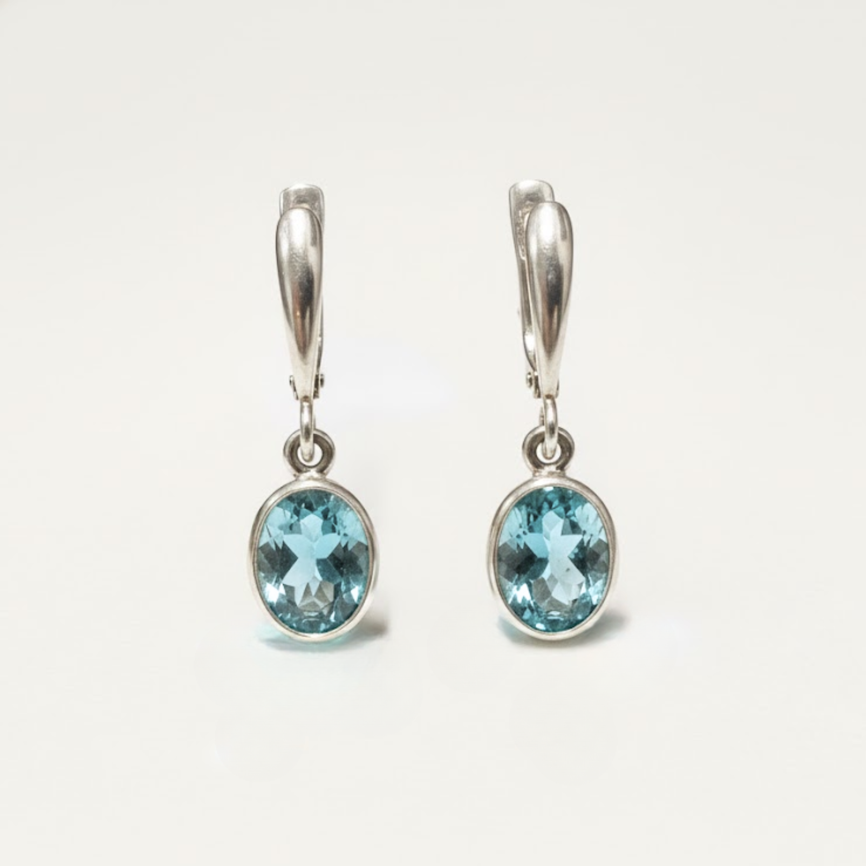 Created Aquamarine Earrings made in 925 Sterling Silver with Oval Created Blue Aquamarine in Bezel setting, March Birthstone gift idea, symbolizes courage & good luck, ideal for everyday wear and perfect for birthday gifting and special occasions.