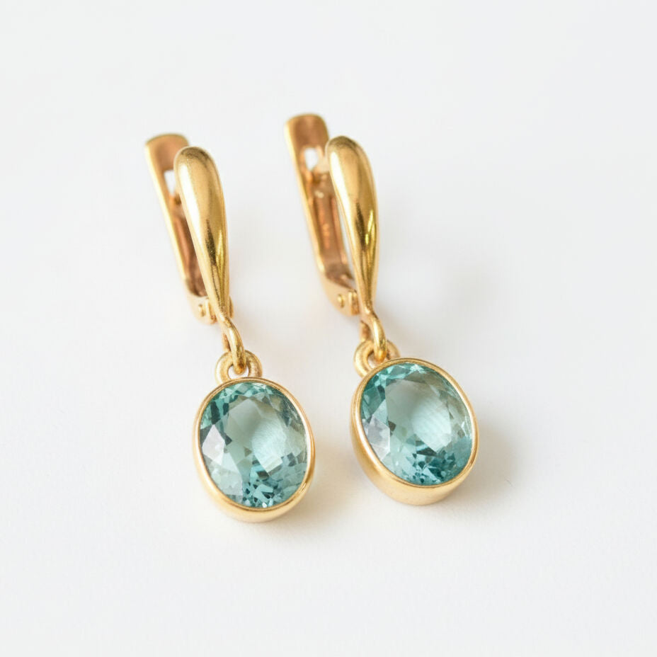 Dazzling aquamarine earrings crafted in 18k Gold Vermeil, showcasing oval stones, a unique gift for any occasion.