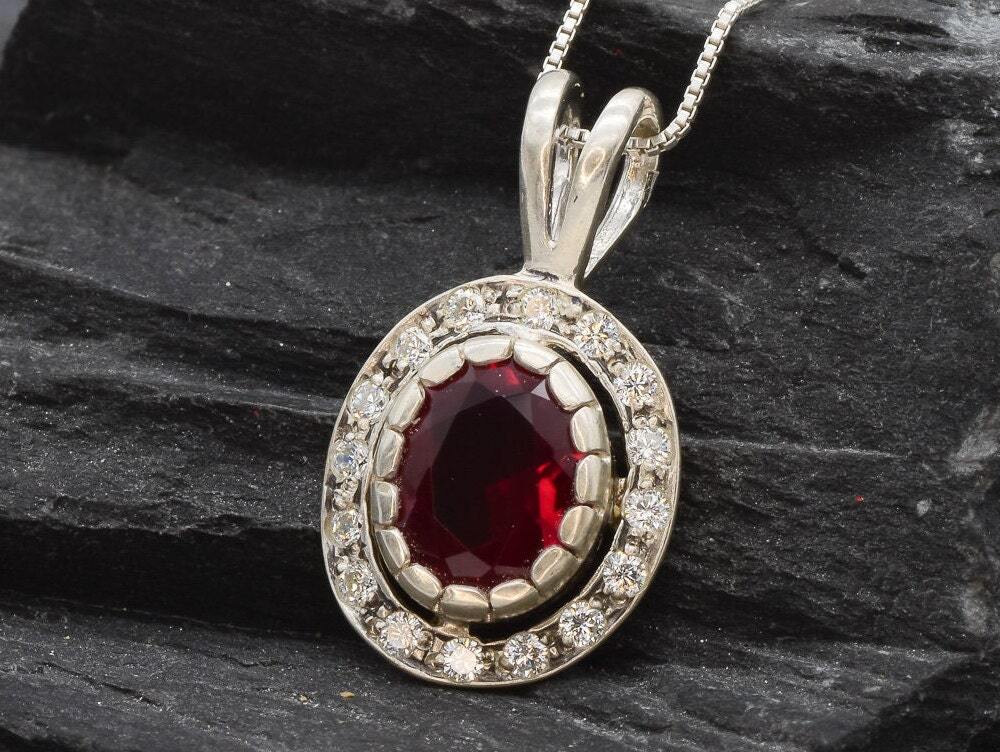 Created Ruby Pendant made in 925 Sterling Silver with Oval Created Red Ruby in Halo setting, July Birthstone gift idea, symbolizes nobility, purity, and passion, ideal for everyday wear and perfect for birthday gifting and special occasions.