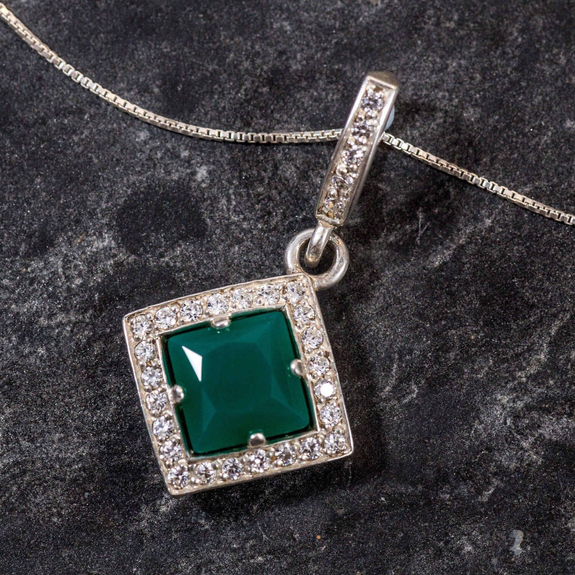 Charming Created Emerald Halo Pendant in 925 Sterling Silver, a symbolic May birthstone gift for special occasions and daily wear.