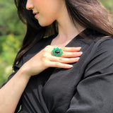 A picturesque mountain landscape with lush greenery and a clear blue sky, creating a serene outdoor scene.