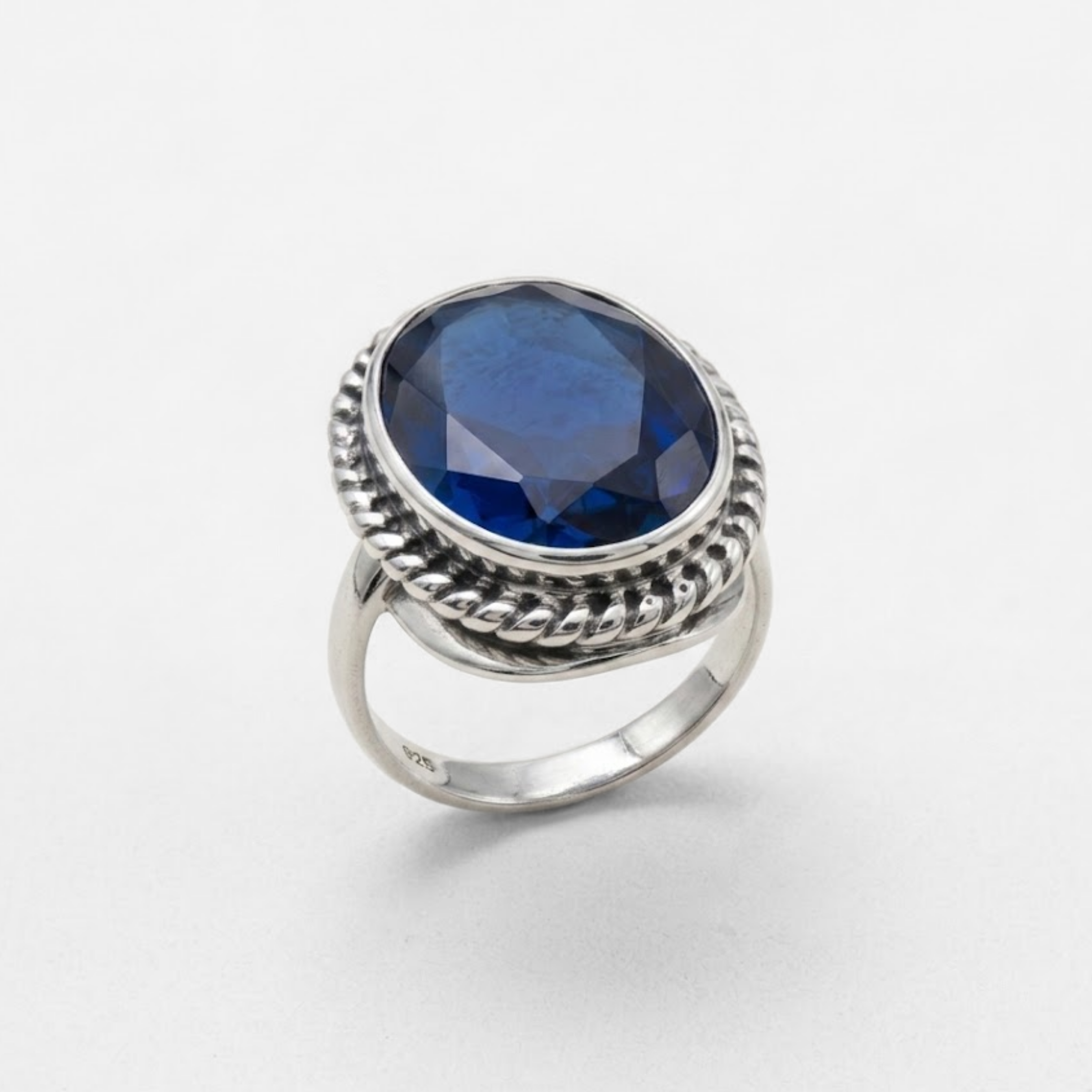 Created Sapphire Ring made in 925 Sterling Silver with Oval Created Blue Sapphire in Bezel setting, September Birthstone gift idea, symbolizes sincerity, truth, and faithfulness, ideal for everyday wear and perfect for birthday gifting and special occasions.