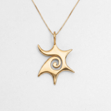 Gold sun pendant necklace with a swirl design, made from 18k Gold Vermeil—perfect for celebrating life's special moments.
