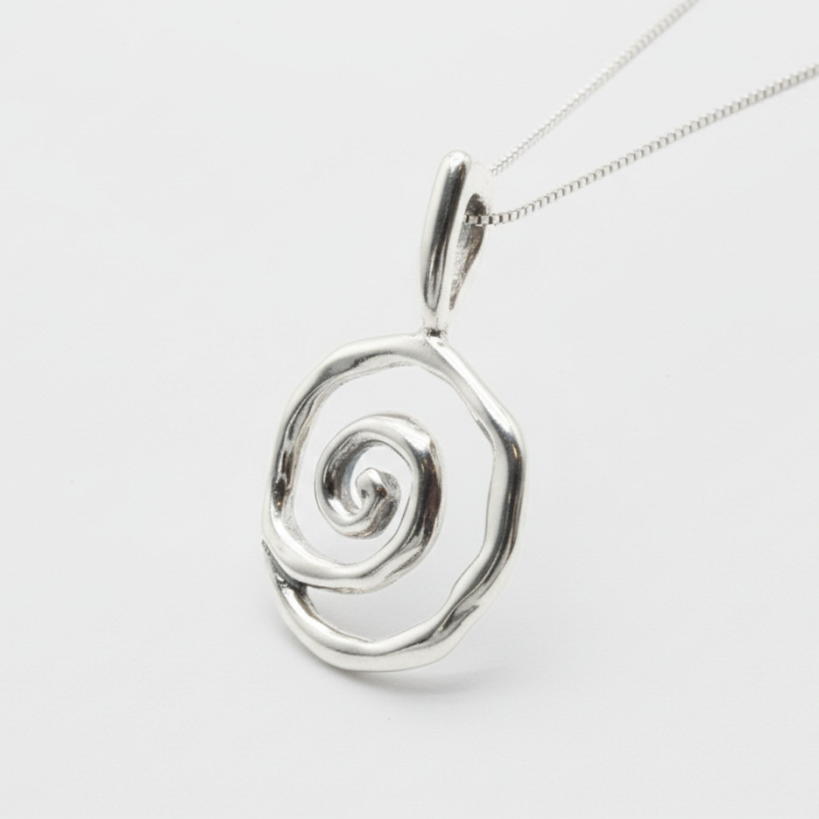 Elegant spiral pendant in 925 sterling silver, perfect for adding a touch of sophistication to everyday outfits.