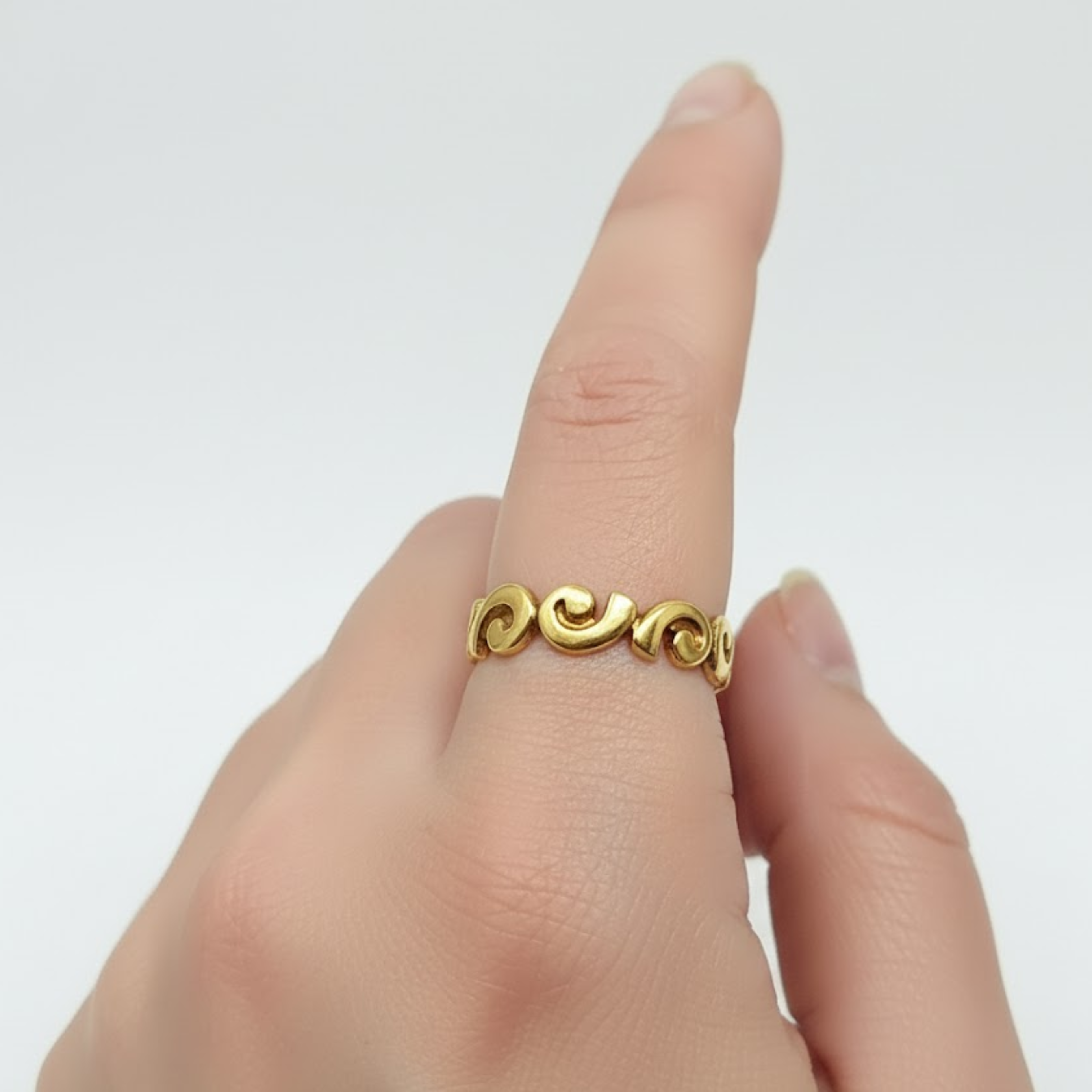 Sleek Gold Spiral Ring in 18k Gold Vermeil, perfect for daily wear and special occasions. Elegant and artistic design.