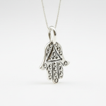 Elegant Gold Fatima Hand Pendant in 925 Sterling Silver, perfect for adding a touch of charm to any outfit or occasion.