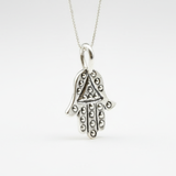Elegant Gold Fatima Hand Pendant in 925 Sterling Silver, perfect for adding a touch of charm to any outfit or occasion.