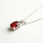 Beautifully crafted Ruby Pendant in 925 Sterling Silver, featuring an oval Created Red Ruby, perfect for special celebrations.
