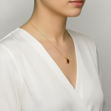 Stunning 18k Gold Vermeil necklace featuring an oval Created Red Ruby, a luxurious symbol of passion and elegance.