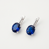 Created Sapphire Earrings made in 925 Sterling Silver with Oval Created Blue Sapphire in Prong setting, September Birthstone gift idea, symbolizes sincerity, truth, and faithfulness, ideal for everyday wear and perfect for birthday gifting and special occasions.