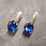 Created Sapphire Earrings made in 925 Sterling Silver with Oval Created Blue Sapphire in Prong setting, September Birthstone gift idea, symbolizes sincerity, truth, and faithfulness, ideal for everyday wear and perfect for birthday gifting and special occasions.