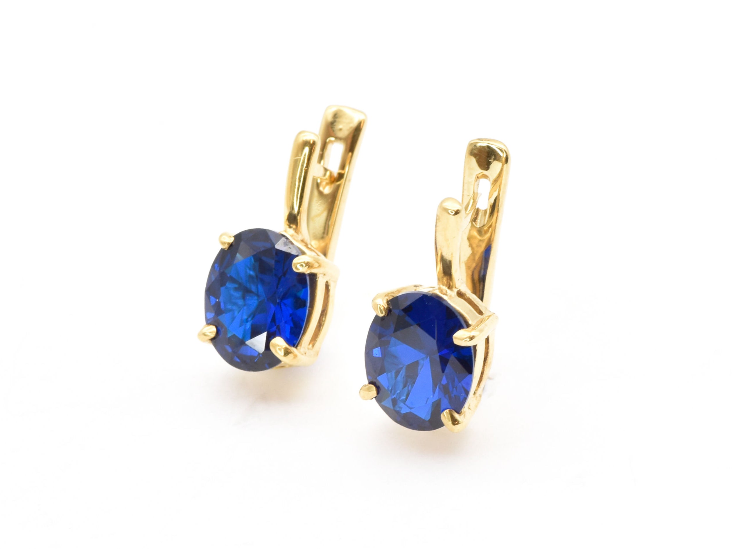 Stylish 18k Gold Vermeil Earrings featuring Oval Created Blue Sapphire, a meaningful gift for September birthdays.
