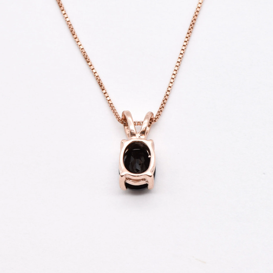 Onyx Rose Gold Necklace - Elegant black onyx pendant set in rose gold, ideal for casual elegance and thoughtful gifts.