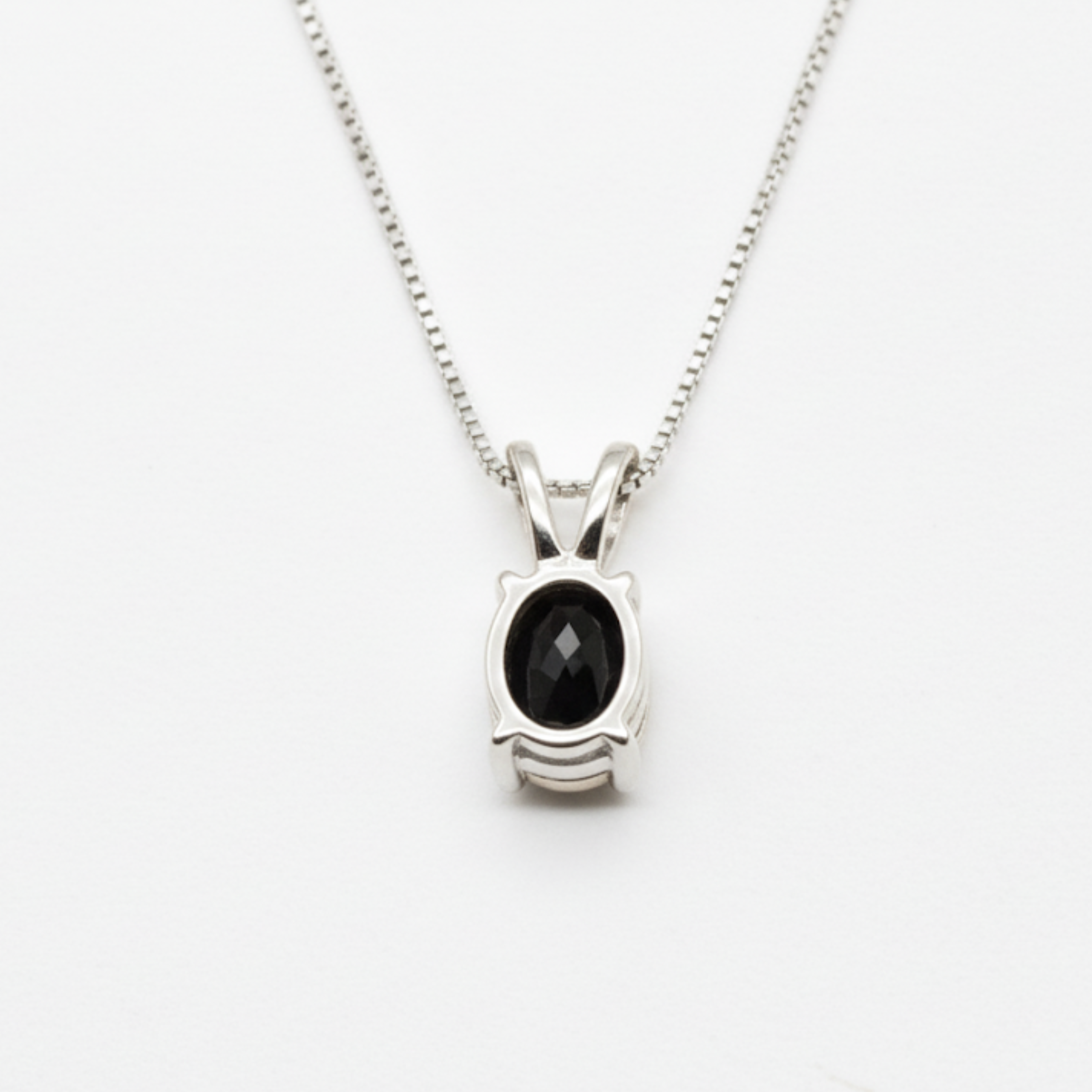 Dazzling Silver Onyx Necklace featuring natural black onyx and diamond details, perfect for elevating any outfit beautifully.
